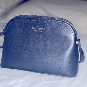 Excellent used condition, Adjustable strap, body bag , perfect for any occasion.